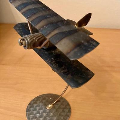 Trench art spark plug airplane