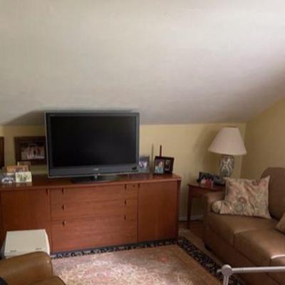 Brown Leather Sleeper Sofa, Sony Bravia 55 inch TV, Credenza