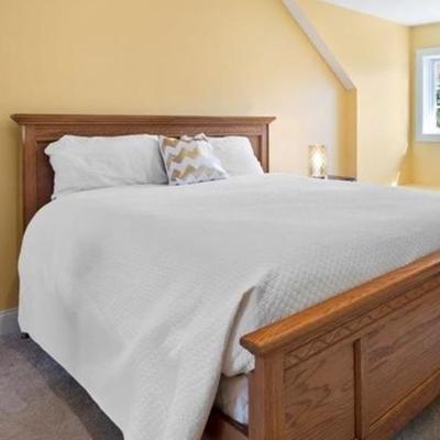 Traditional Queen Oak Panel Bed  (mattress not included).  Uncomplicated your life with this expertly crafted timeless bedframe with...