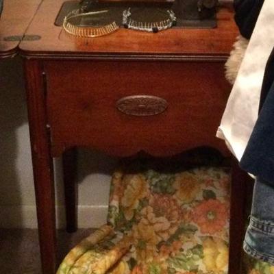 Singer sewing machine in cabinet