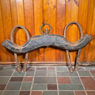 OX YOKE | 19th C Ox Yoke in old worn black paint with round iron lead. - l. 47 x w. 6 x h. 29 x dia. To end of in 