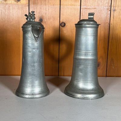 (2PC) 18TH C PEWTER FLAGONS | 18th and 19th C Flagons: (1) Inscribed â€œHIK AMH 1744â€ with great inscribed designs around names and...