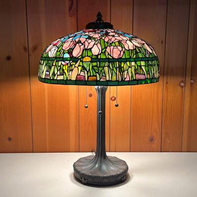 TIFFANY STYLE LAMP W/PEACH TULIP SHADE | Great Tiffany style design of the shade and the bronze color base. Ornate shade features peach...