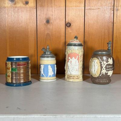 (5PC) METTLACH STEINS #3 | Mettlach Group Includes: (1) #1005 Figures in relief in Peach. (1) #1028 Figures in relief in Brown. Gnome on...