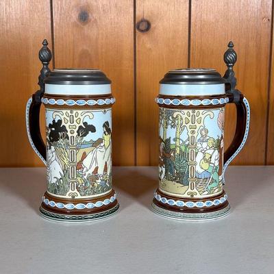 (2PC) METTLACH STEINS #2 | Includes: (1) 2902 Fairy Tales. Rumplestiltskin etc. (1) 2901 Fairy Tales Snow White etc. - h. 8.5 x dia. 4 in 