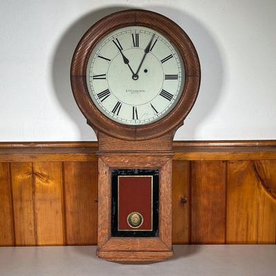 E. HOWARD WALL CLOCK | â€œE. Howard & Co. Bostonâ€. An Edward Howard Wall Clock Model 70 in an oak case. Has original pendulum, a...