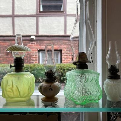 Antique oil lamps, lots of different sizes, from minis to large
