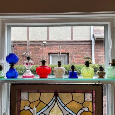 Antique oil lamps, lots of different sizes, from minis to large