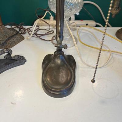 A large selection of antique green case glass lamps and shades, including Handel basesâ€”floor lamps, desk lamps, table lamps