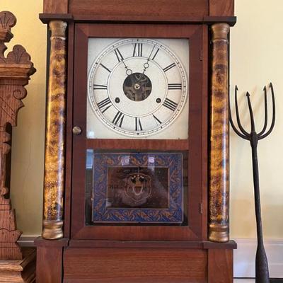 Lots of antique clocksâ€”mantel clocks, grandmother clocks and wall clocks