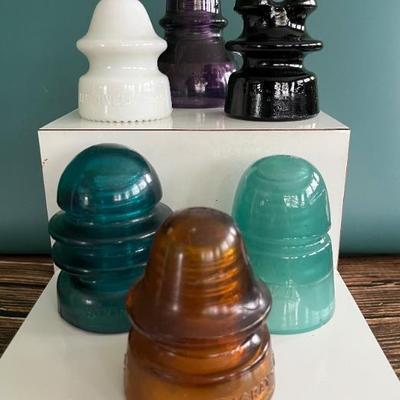 Antique glass electric insulators: lots of colors: carnival glass, marigold, milk glass, black, blue, cobalt, turquoise, amber, green,...