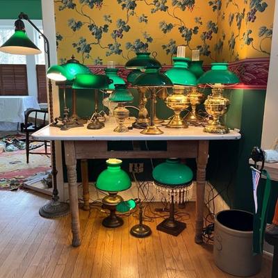 A large selection of antique green case glass lamps and shades, including Handel basesâ€”floor lamps, desk lamps, table lamps