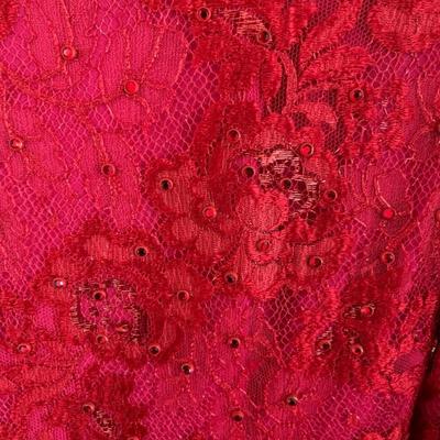 1980s Bob Mackie couture dress in red, red and hot pink lace bodice with full tulle skirt layered in red, lavender, pink and orange with...