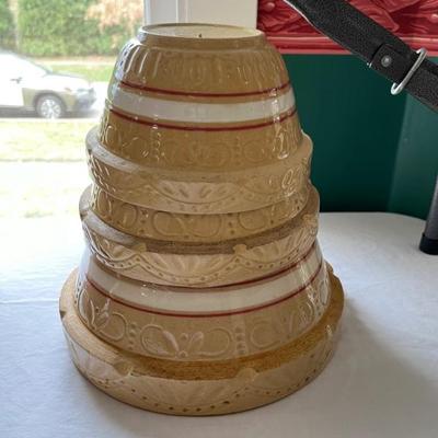 Lots of antique stoneware mixing bowlsâ€”Bennington Pottery, Roseville, and more