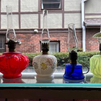 Antique oil lamps, lots of different sizes, from minis to large