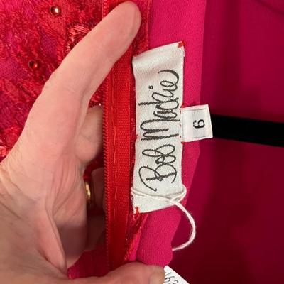 1980s Bob Mackie couture dress in red, red and hot pink lace bodice with full tulle skirt layered in red, lavender, pink and orange with...