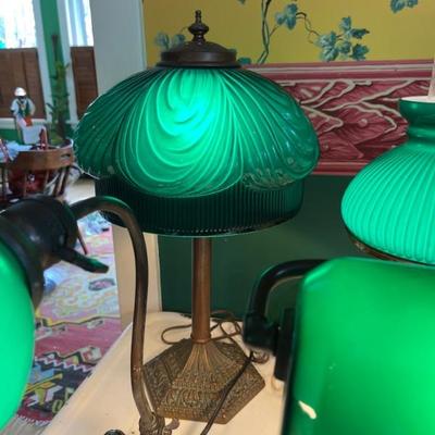 A large selection of antique green case glass lamps and shades, including Handel basesâ€”floor lamps, desk lamps, table lamps