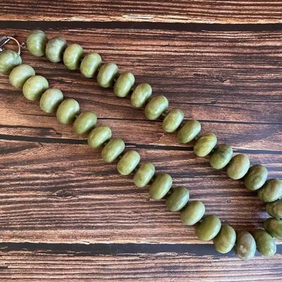 Long necklace with large green agate beads and a silver clasp