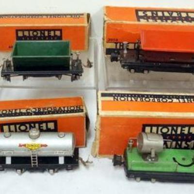 1135	LIONEL O GAUGE 6 TRAIN CARS, #3859 DUMPER, #659 DUMPER, #804 SUNCO CAR, #2820 SEARCH LIGHT, #657 CABOOSE
