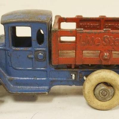 1241	ANTIQUE CAST IRON TOY STAKE BODY LIVESTOCK TRUCK, APPROXIMATELY 9 IN X 3 3/4 IN H
