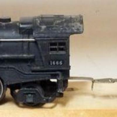 1144	LIONEL O GAUGE TRAIN #1666 LOCOMOTIVE WITH #2689W TENDER
