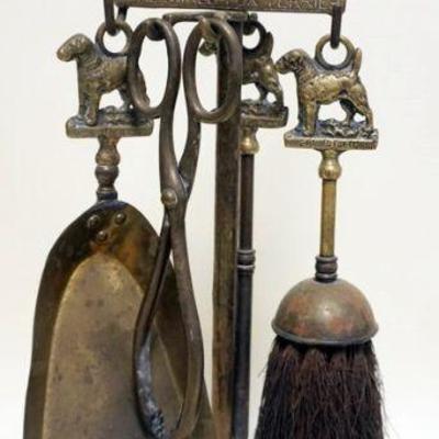 1195	BRASS MINIATURE FIREPLACE SET DEPICTING WIRE HAIRED FOX TERRIER, APPROXIMATELY 19 IN H
