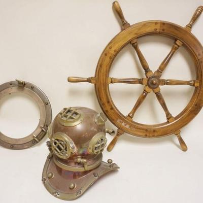 1251	BRASS & COPPER MODEL OF DIVERS HELMENT AND PORT WINDOW AND WOOD CAPTAINS WHEEL, HELMET APPROXIMATELY 12 IN H
