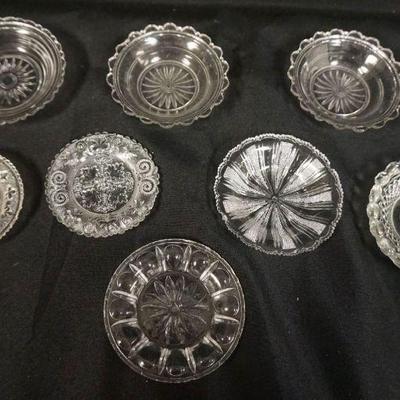 1171	PRESSED SANDWICH GLASS CUP PLATES, GROUP OF 8, LARGEST APPROXIMATELY 4  IN
