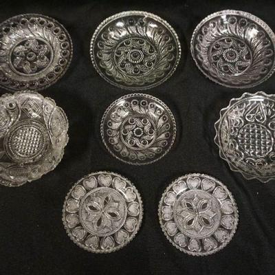 1172	PRESSED SANDWICH GLASS CUP PLATES, GROUP OF 8, LARGEST APPROXIMATELY 4  IN
