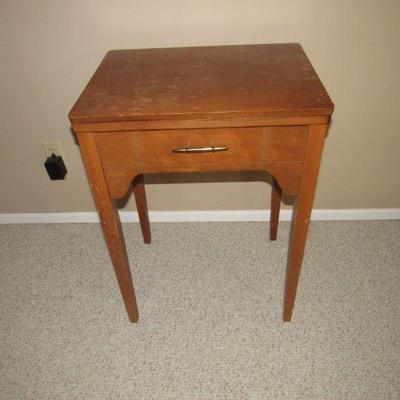 Singer sewing machine in cabinet