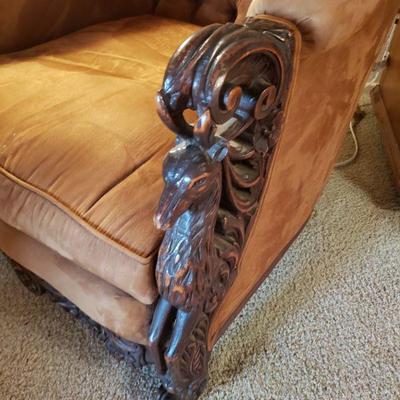 Carved stags on arms