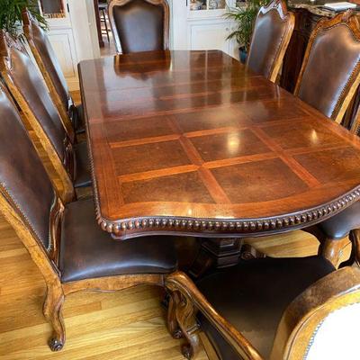 76" by 47" with three leaves each 18" and 8 chairs
