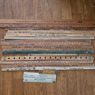 #3026 â€¢ 19 Advertising Yard Sticks and Measuring Tools
