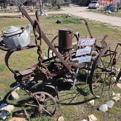 #1212 â€¢ Antique John Deere Plow with Sign
