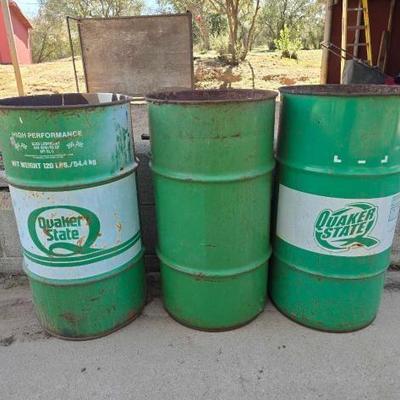 #5002 â€¢ Two Quaker State 10gal Metal Drums and One 10gal Metal Drum
