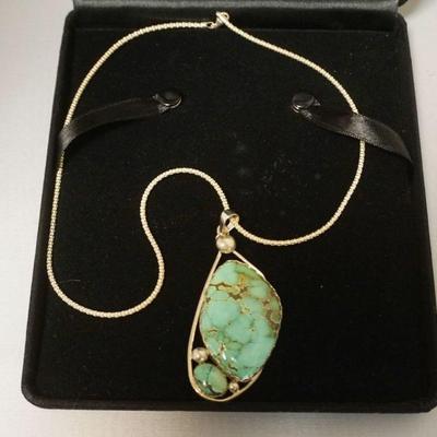 1253	STERLING SILVER TURQUOISE NECKLACE, 18 IN CHAIN, PENDANT MEASURES APPROXIMATELY 3 IN X 1 1/2 IN W

