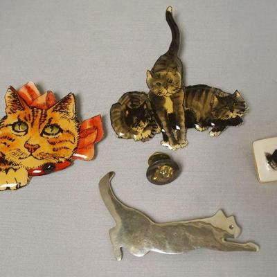 1215	CUT OUT METAL CAT PIN SIGNED S.H. 88, 2 1989 MB DESIGNS CAT PINS, PORCELAIN CAT PIN MARKED B. 92 AAND METAL LAPEL CAT PIN
