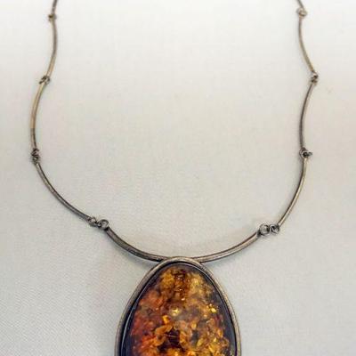 1239	ORANGE AMBER TYPE NECKLACE, APPROXIMATELY 12 IN L, STONE APPROXIMATELY 3 IN X 2 IN W
