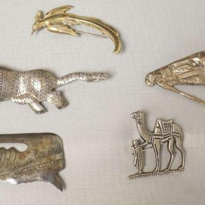 1255	STERLING SILVER ASSORTMENT OF ANIMAL PINS INCLUDING CAMEL MARKED JERUSALEM AND BIRD MARKED FORSTNER. 1.61 TOZ
