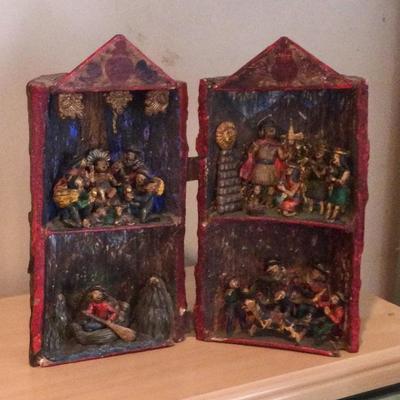 Carved scenes in log