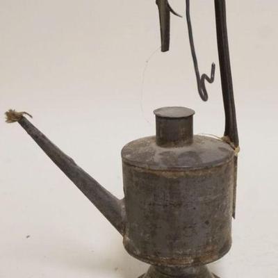 1210	PRIMITIVE TIN OIL LAMP APPROXIMATELY 9 IN H
