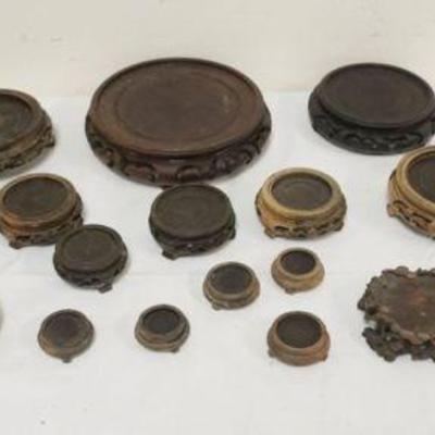 1126	GROUP OF ASSORTED ASIAN WOOD STANDS, LARGEST APPROXIMATELY 7 1/2 IN ROUND

