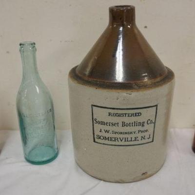1172	2 TONE BROWN JUG STAMPED SOMERVILLE NJ SOMERSET BOTTLING CO WITH 3 SOMERSET BOTTLES
