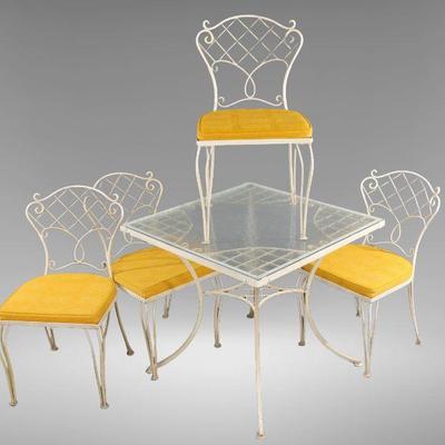MCM wrought iron patio table and four chairs