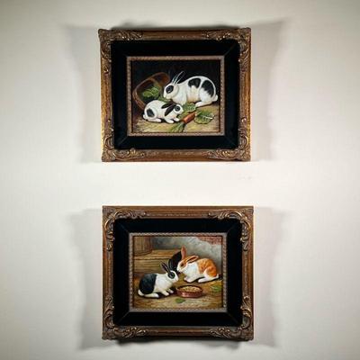 PAIR RABBIT PAINTINGS | Oil paintings in matching gilt frames, one showing two rabbits eating carrots and leaves, the other showing two...