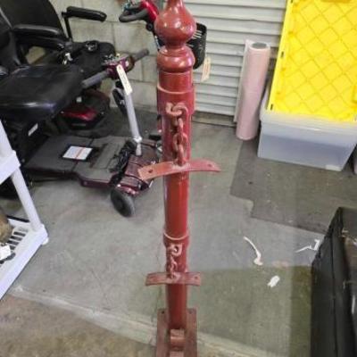 #1994 • Red Metal Floor Mount Hitching Post Pole with 2 Chain Mounts.

