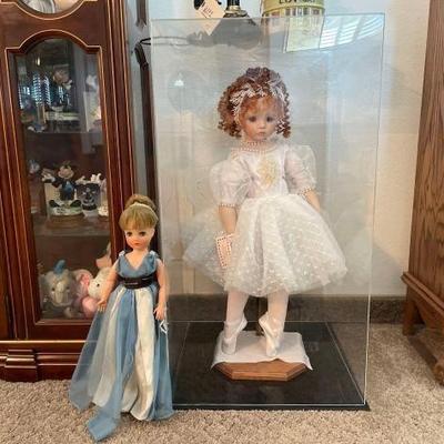 #60094 • 2 Dolls on Stands and one in a Display Case

