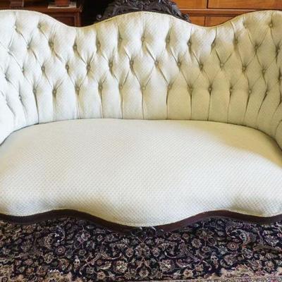 1195	WANUT VICTORIAN LOVE SEAT WITH CARVED CREST AND TUFTED BACK, APPROXIMATELY 62 IN X 24 IN X 37 IN H

