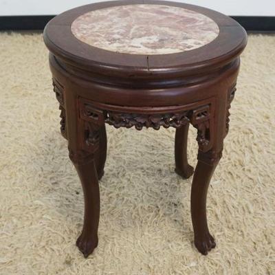 1130	ROUND ASIAN STAND WITH BROWN MARBLE INSET TOP, PIERCED CARED SKIRT, APPROXIMATELY 16 IN X 20 IN H
