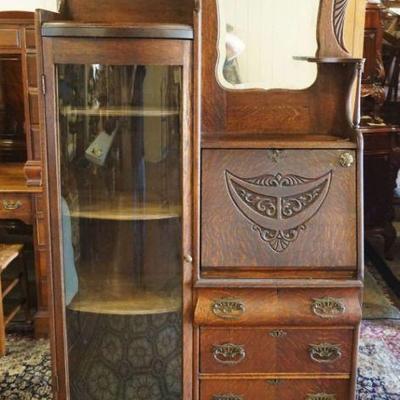 1196	ANTIQUE OAK SIDE BY SIDE WITH CARVED GALLERY AND MIRRORED BACK, APPROXIMATELY 39 IN X 14 IN X 75 IN H
